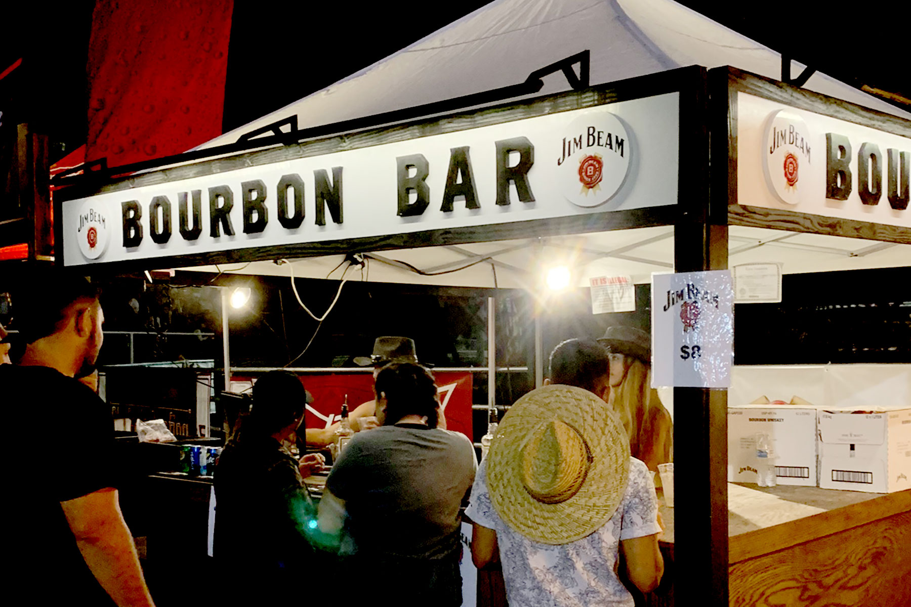Bourbon Bar lit signage at rodeo